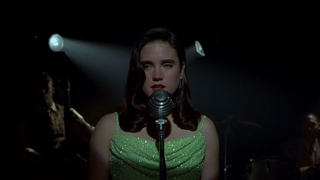 Movies like Ready Player One: Jennifer Connelly's character Emma Murdoch seduces us with her sultry tones in "Dark City"