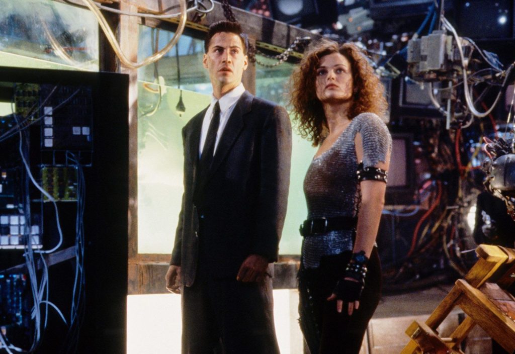 Movies like Ready Player One: Johnny and Jane explore a grimy, neon-rotted future in "Johnny Mnemonic"